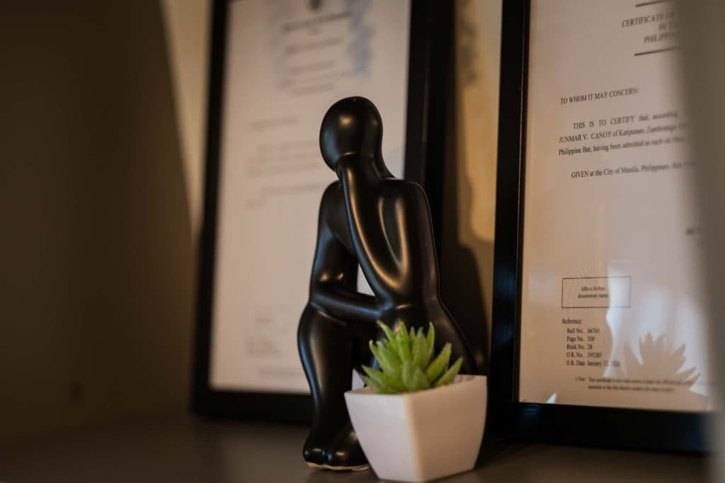 Philippine Bar certificate and decorative statue