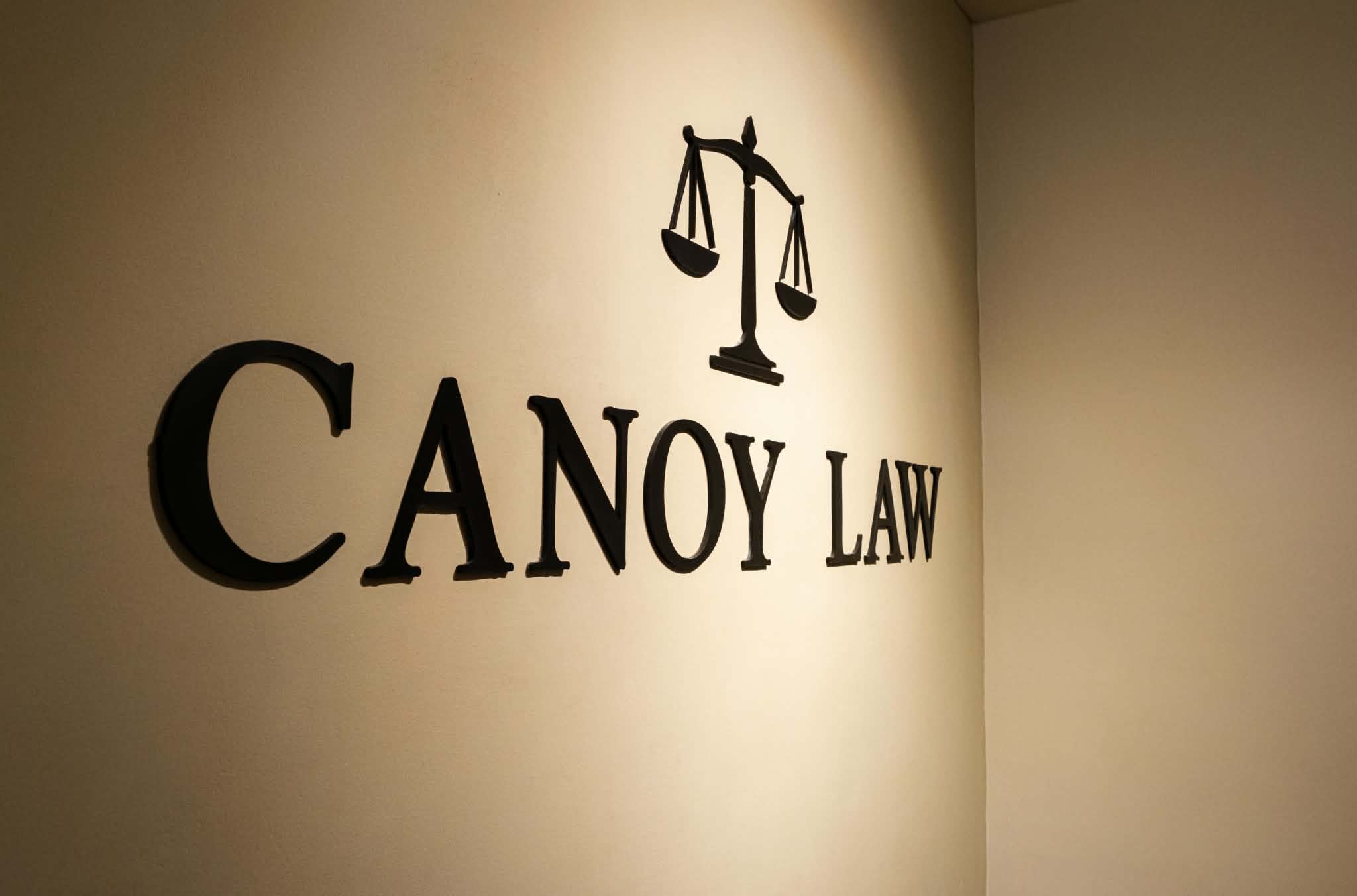 Canoy Law wall sign with scales of justice