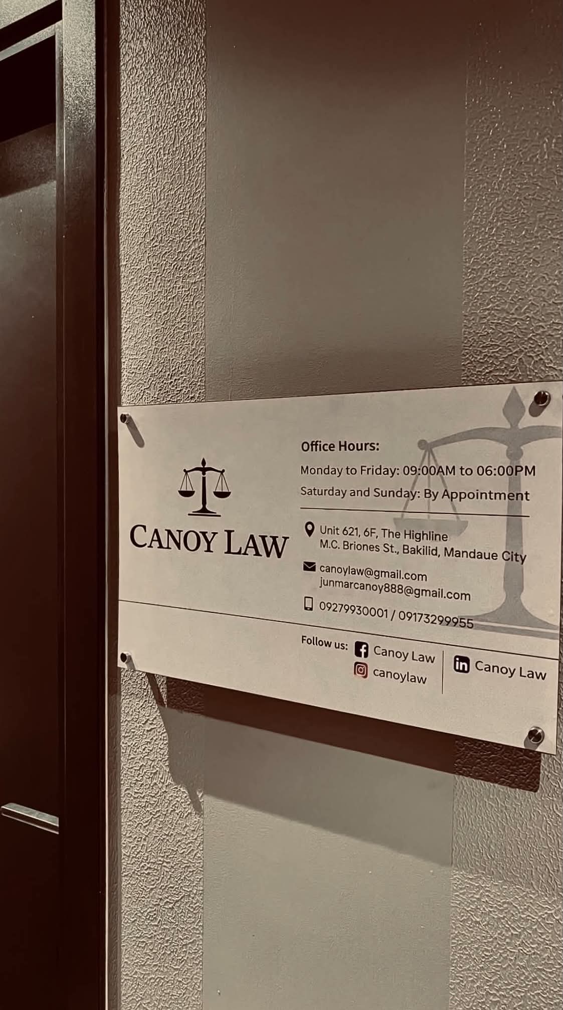 Canoy Law office hours and contact information sign