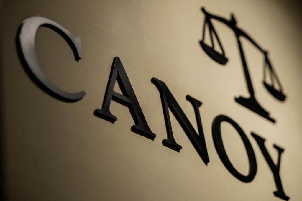 CANOY LAW wall signage and scales of justice